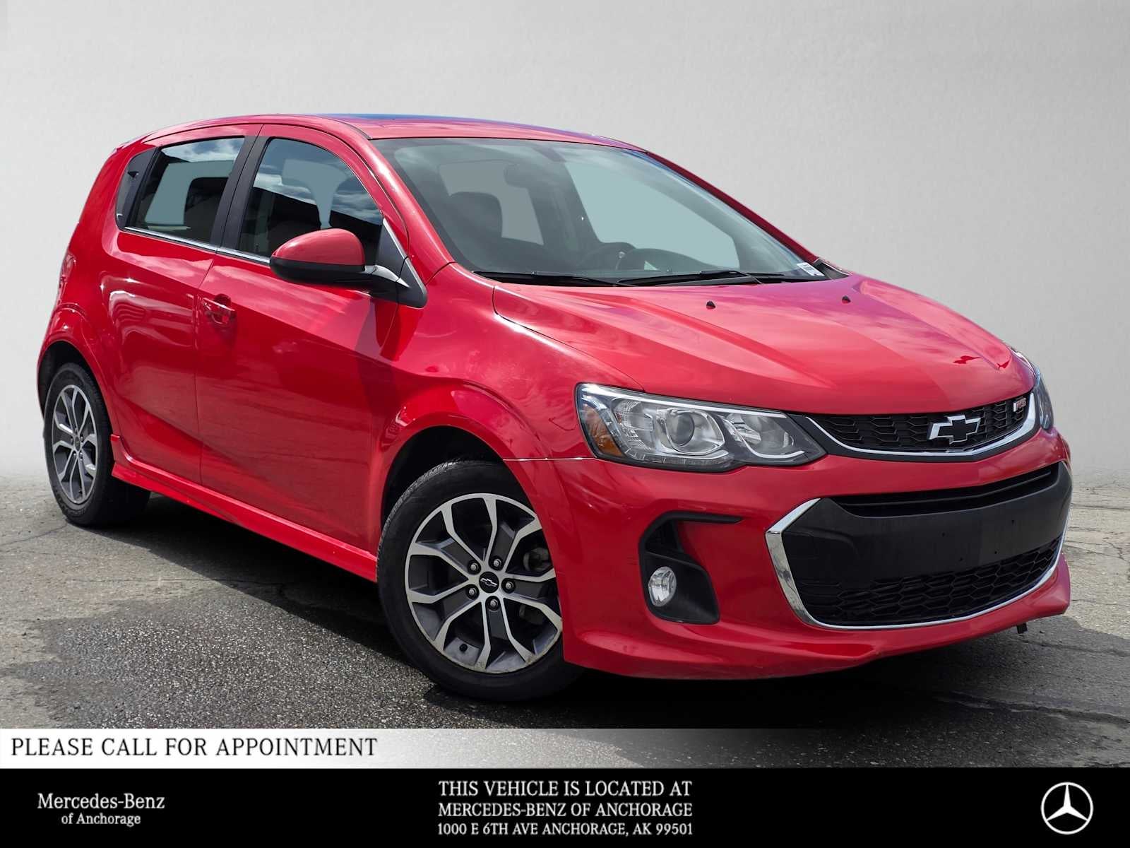 2018 Chevrolet Sonic LT in Red Hot — front three-quarter view